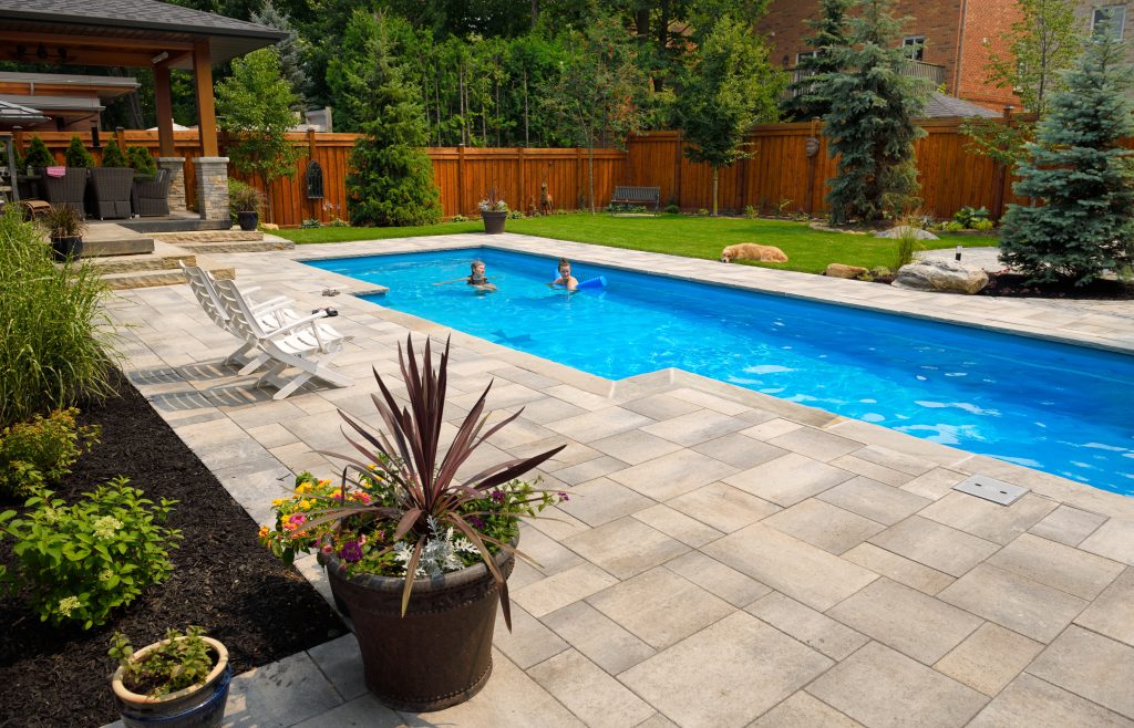 Maintained landscaping around a paver walkway